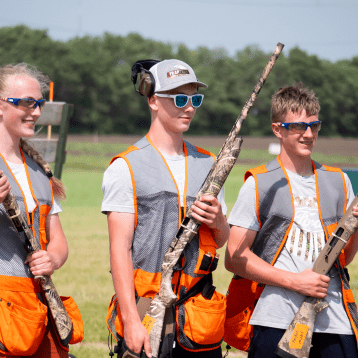 A group of people holding rifles.